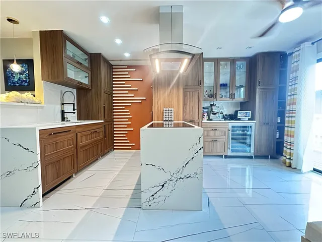 a kitchen with cabinets and window
