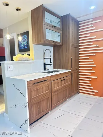 a spacious bathroom with a sink a mirror and a window