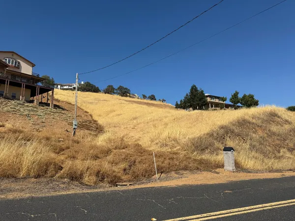 a view of a house with a snow on the road