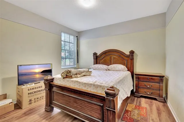 a bedroom with a bed and dresser