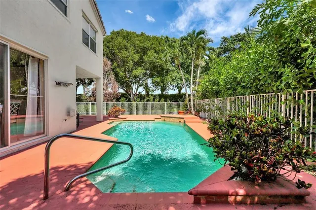 a view of a swimming pool with a patio