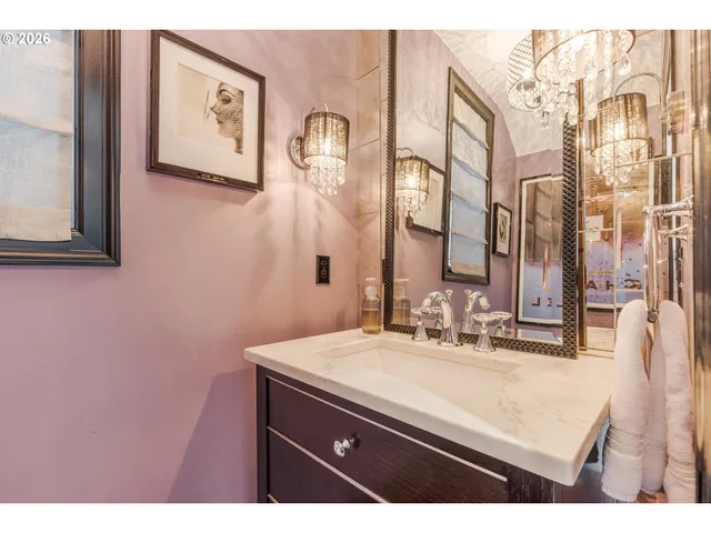 a bathroom with a sink vanity and a mirror