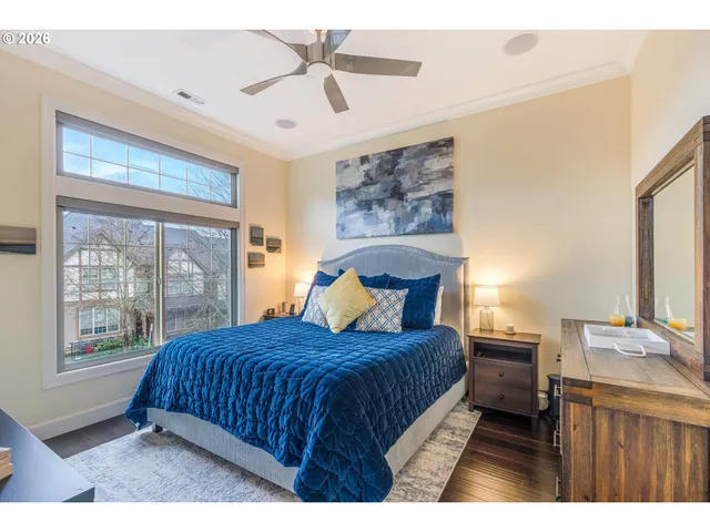 a bedroom with a large bed and a window