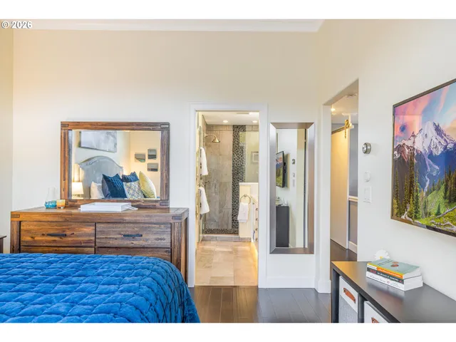 a living room with a furniture and a flat screen tv