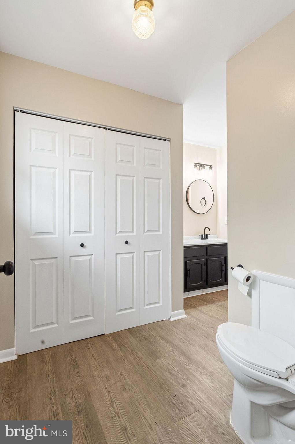 225 Bragg Circle Hanover, PA 17331 - Photo 14 of 32 a bathroom with a toilet a sink and mirror