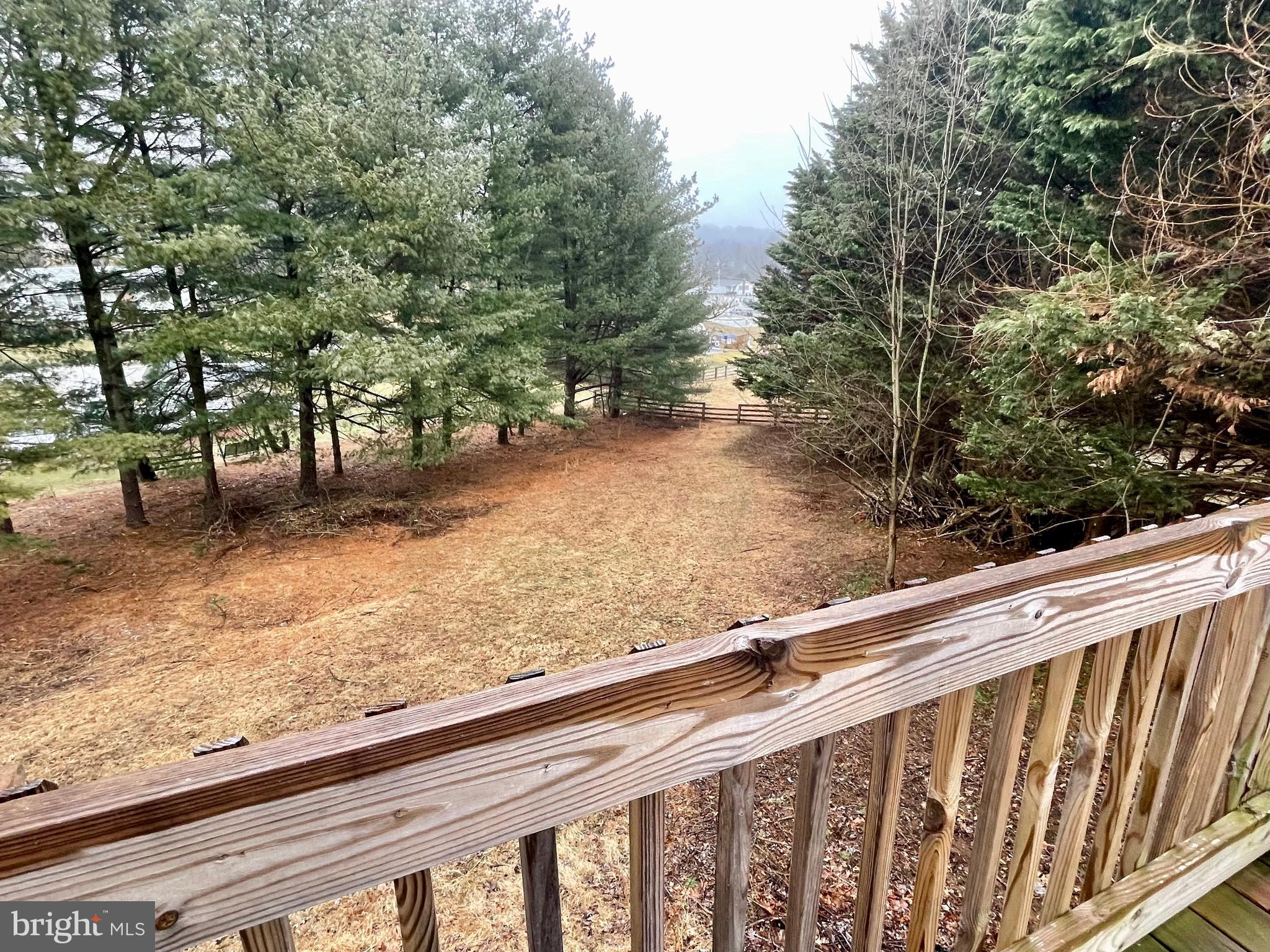 225 Bragg Circle Hanover, PA 17331 - Photo 2 of 32 a view of a roof deck with wooden fence and floor