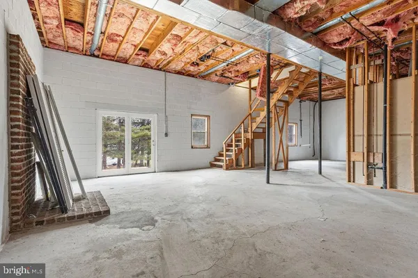 a view of an empty room with windows