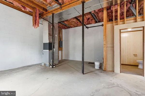 a view of a room with wooden walls