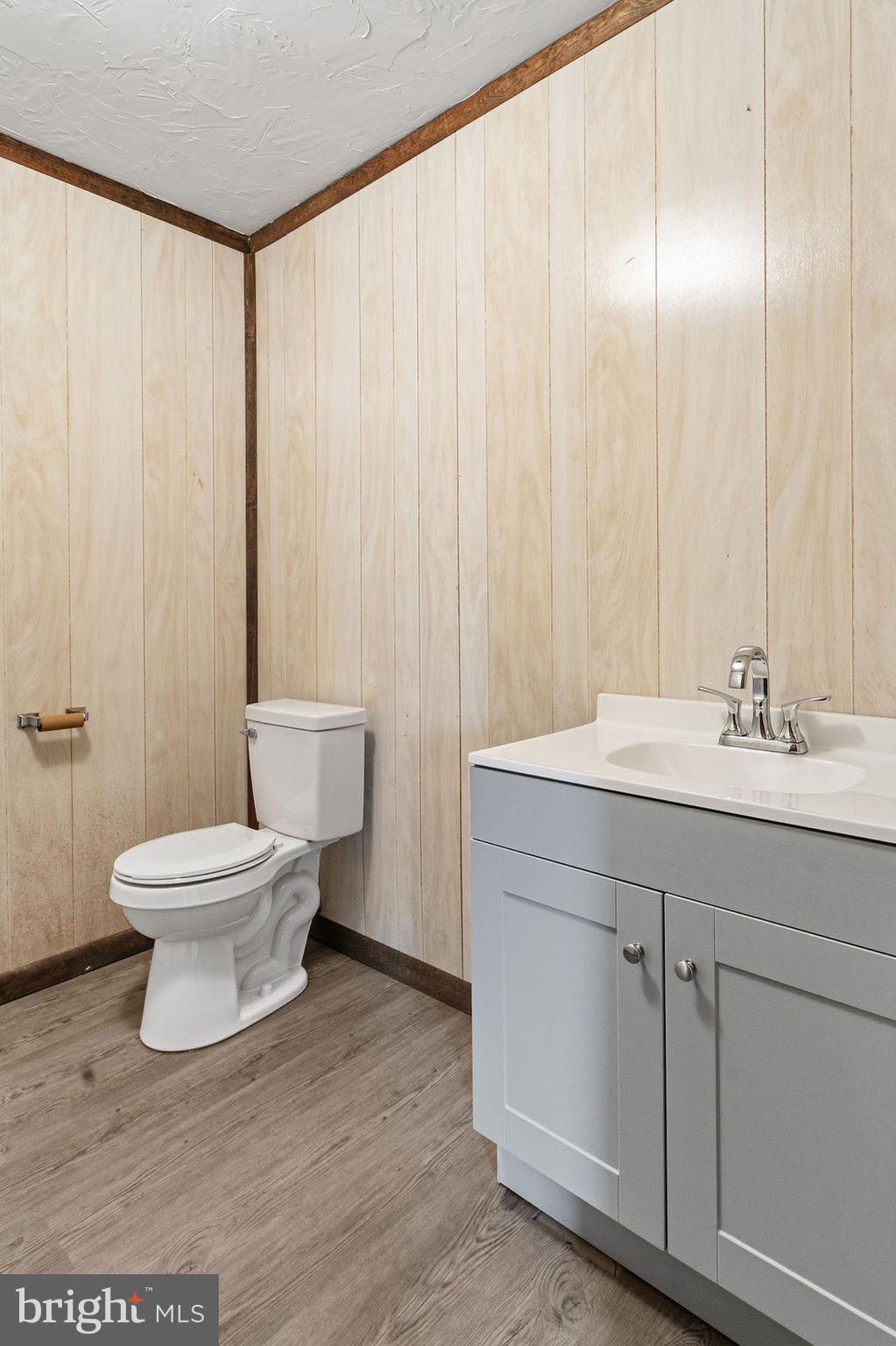 225 Bragg Circle Hanover, PA 17331 - Photo 24 of 32 a bathroom with a sink a toilet and a mirror