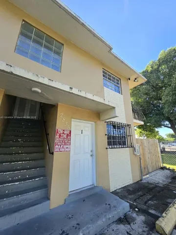 a view of a backyard of a house