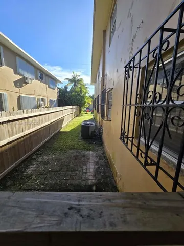 an empty room with wooden floor and closet