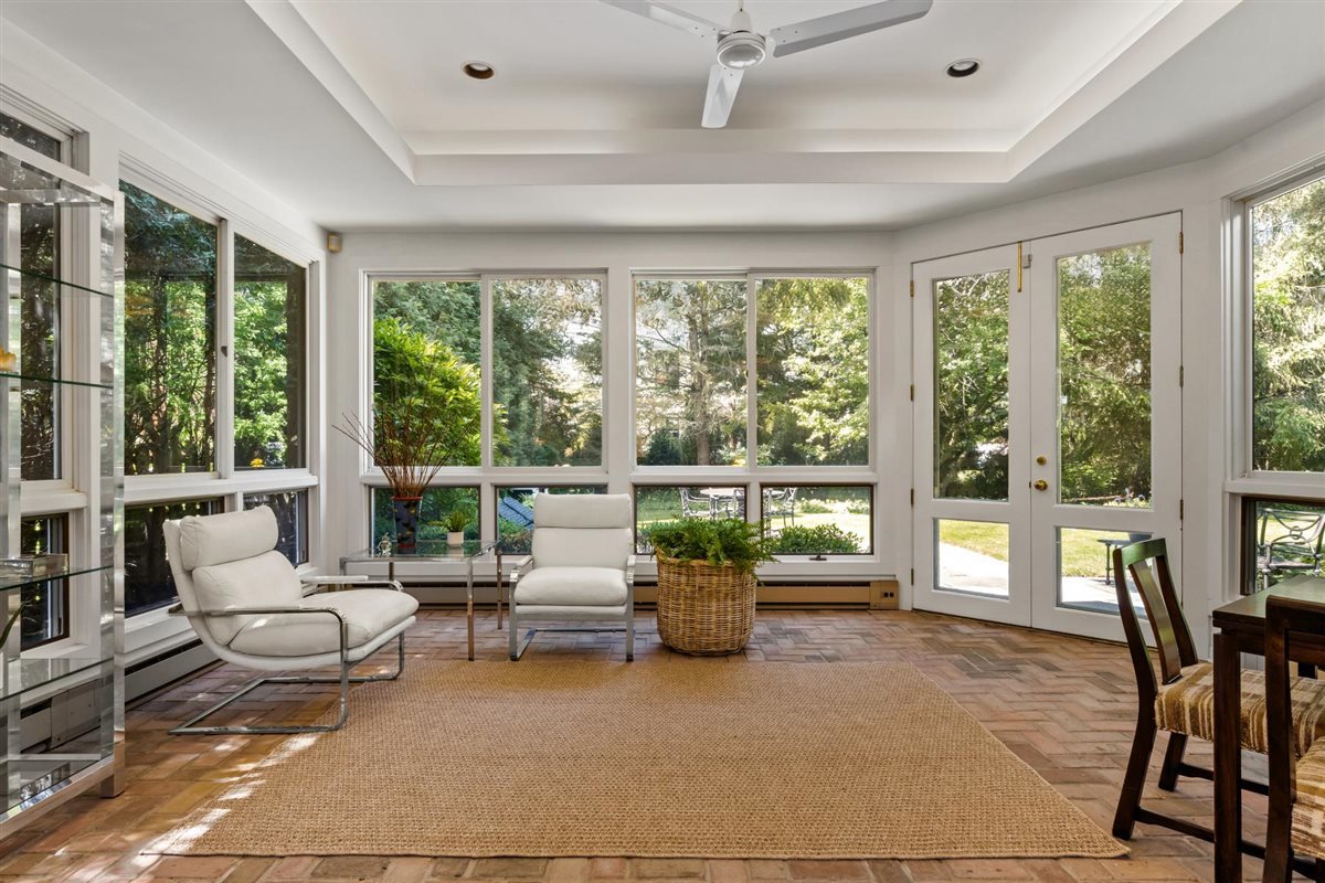 356 Sheridan Road Glencoe, IL 60022 - Photo 11 of 33 a living room with furniture and a floor to ceiling window