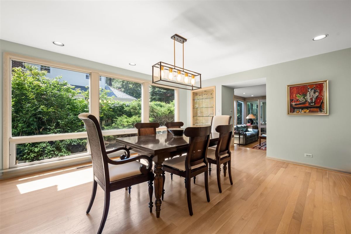 356 Sheridan Road Glencoe, IL 60022 - Photo 14 of 33 a view of a dining room with furniture window and wooden floor