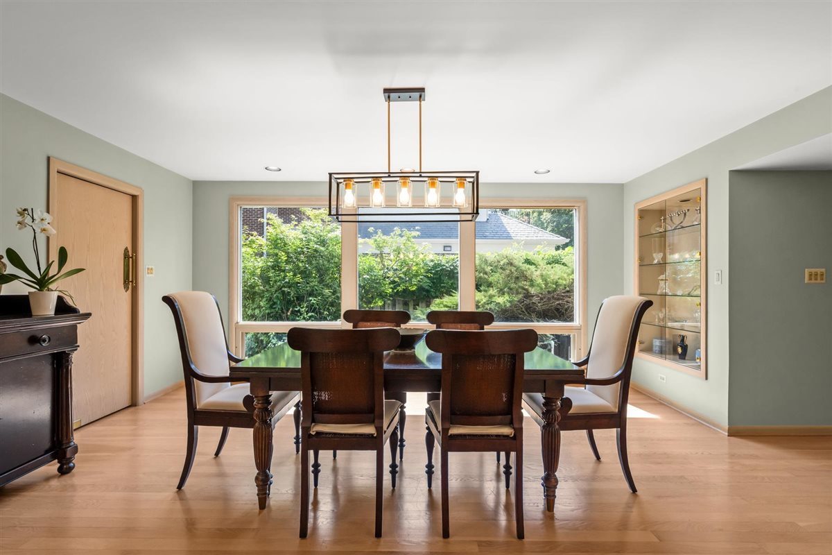 356 Sheridan Road Glencoe, IL 60022 - Photo 15 of 33 a view of a dining room with furniture window and wooden floor