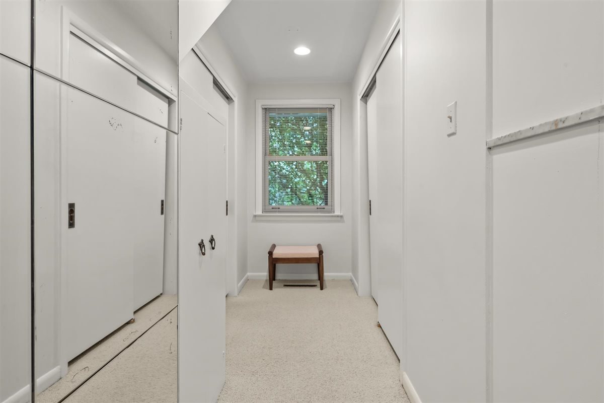 356 Sheridan Road Glencoe, IL 60022 - Photo 19 of 33 a hallway with chair and a window