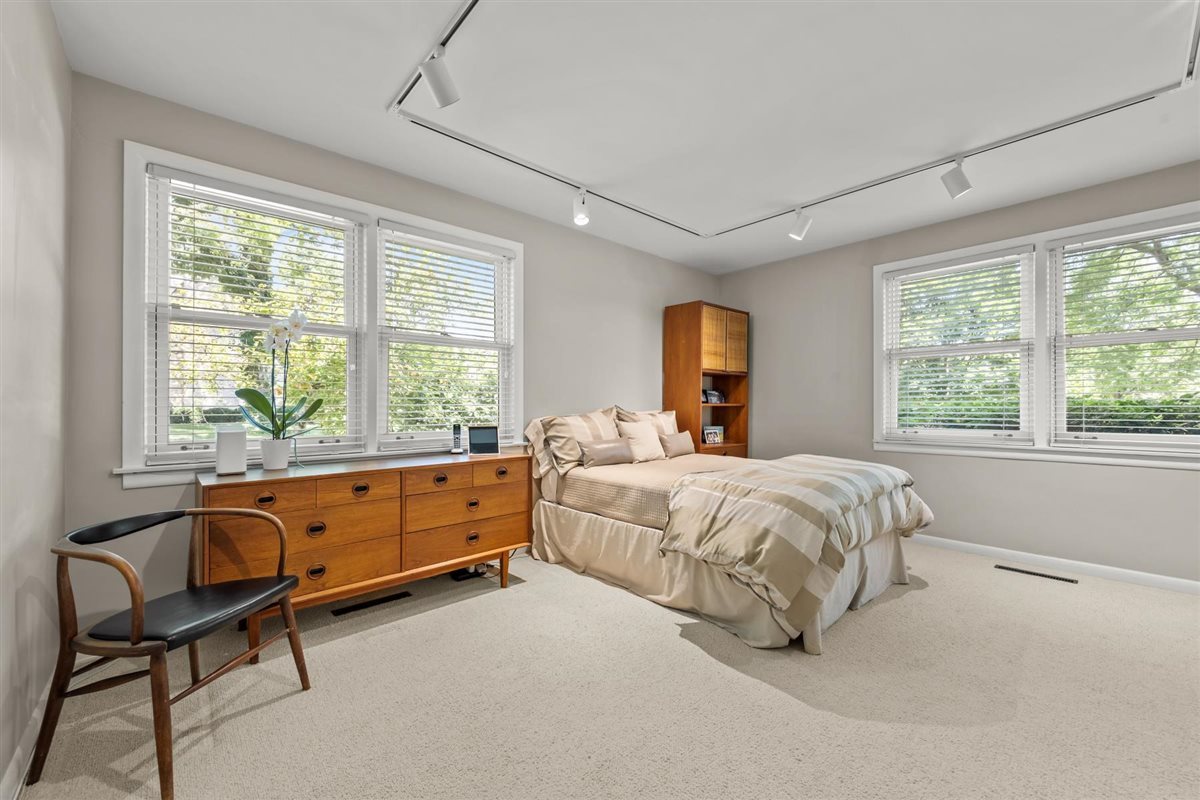 356 Sheridan Road Glencoe, IL 60022 - Photo 21 of 33 a spacious bedroom with a bed and a large window