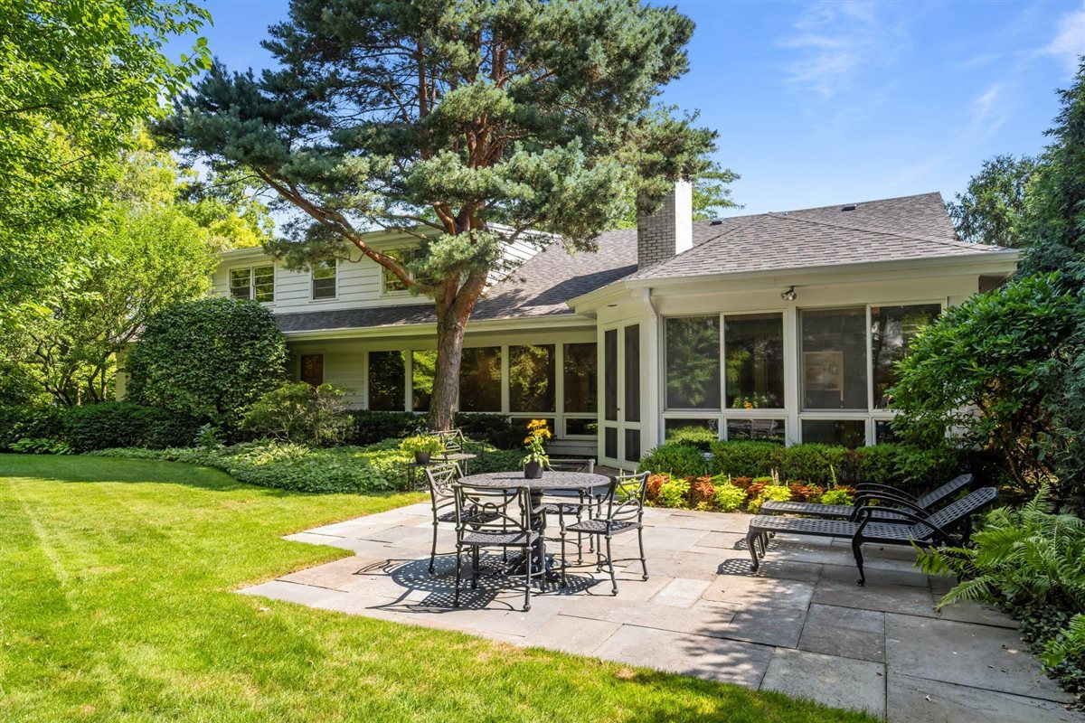 356 Sheridan Road Glencoe, IL 60022 - Photo 31 of 33 a view of a house with backyard sitting area and garden