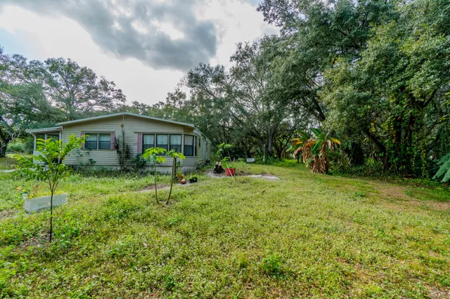 a view of outdoor space with deck and yard