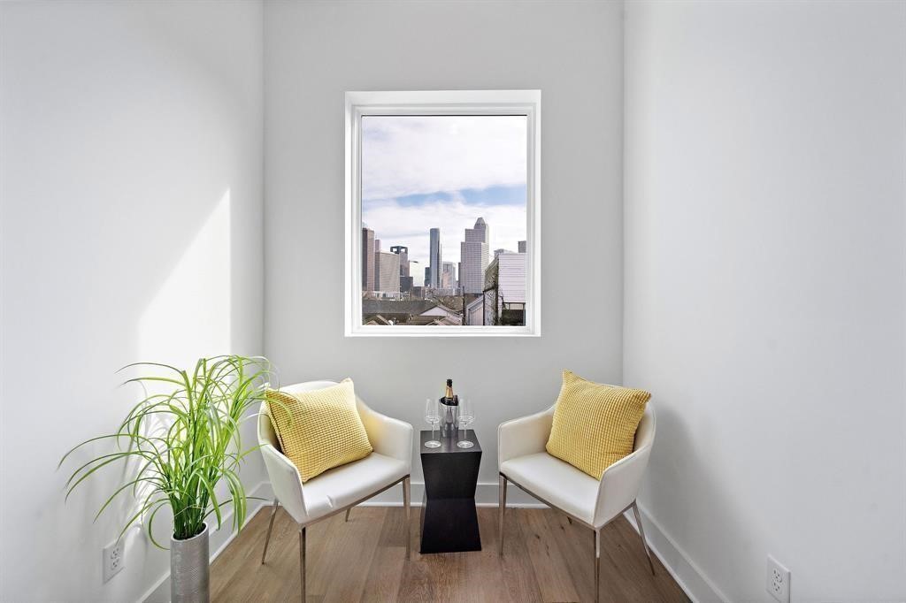 1404 Bailey Street Houston, TX 77019 - Photo 21 of 23 a view of a livingroom with furniture and a potted plant