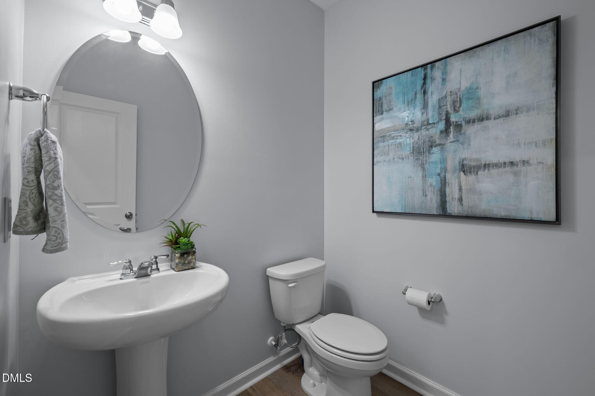 17 Rambler Lane Morrisville, NC 27560 - Photo 17 of 50 a bathroom with a toilet sink and mirror