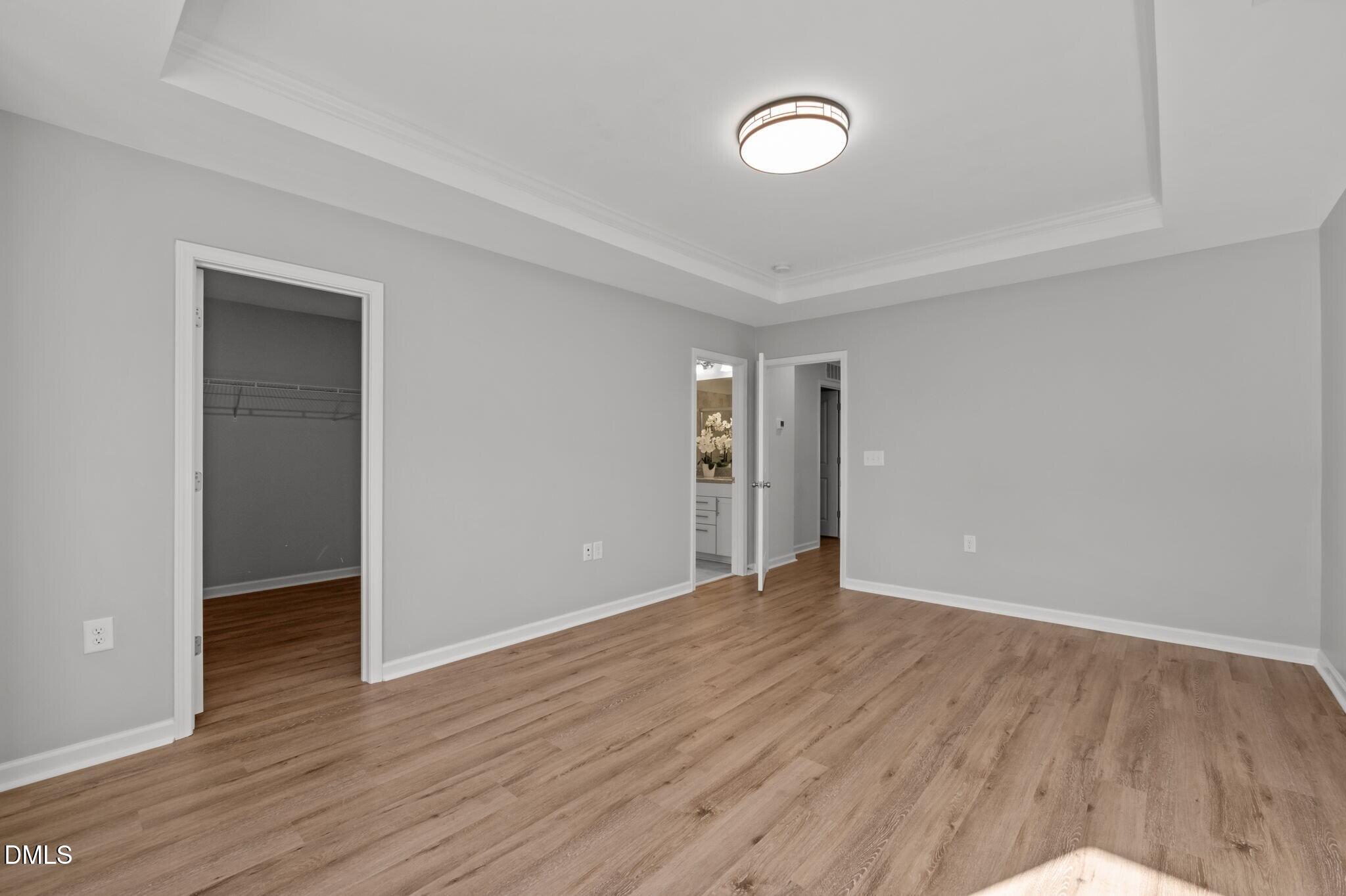 17 Rambler Lane Morrisville, NC 27560 - Photo 22 of 50 a view of an empty room with wooden floor