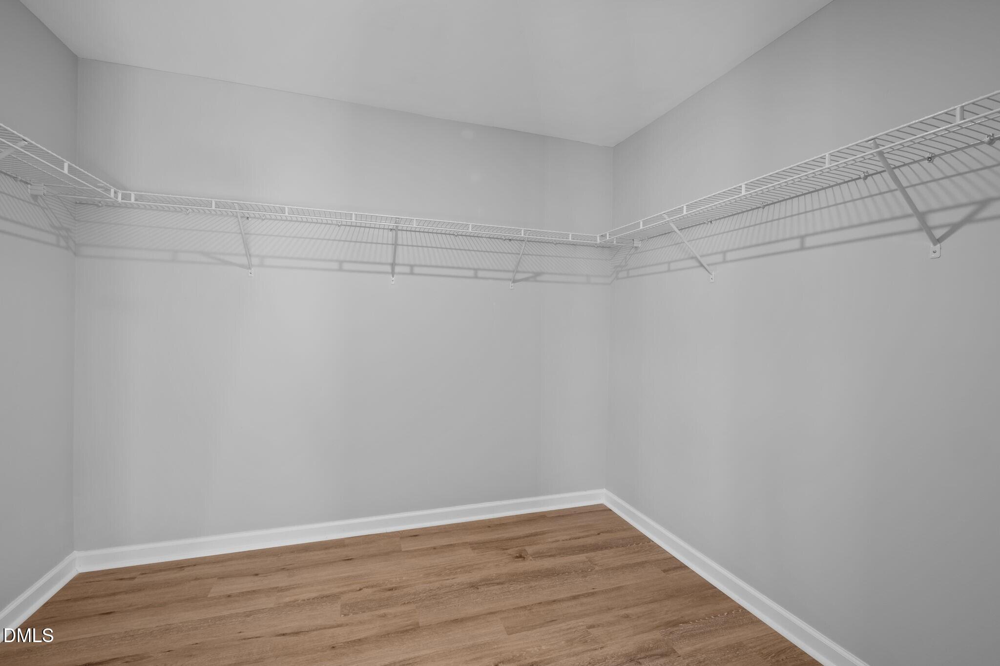 17 Rambler Lane Morrisville, NC 27560 - Photo 23 of 50 a view of a room with shelf and wooden floor