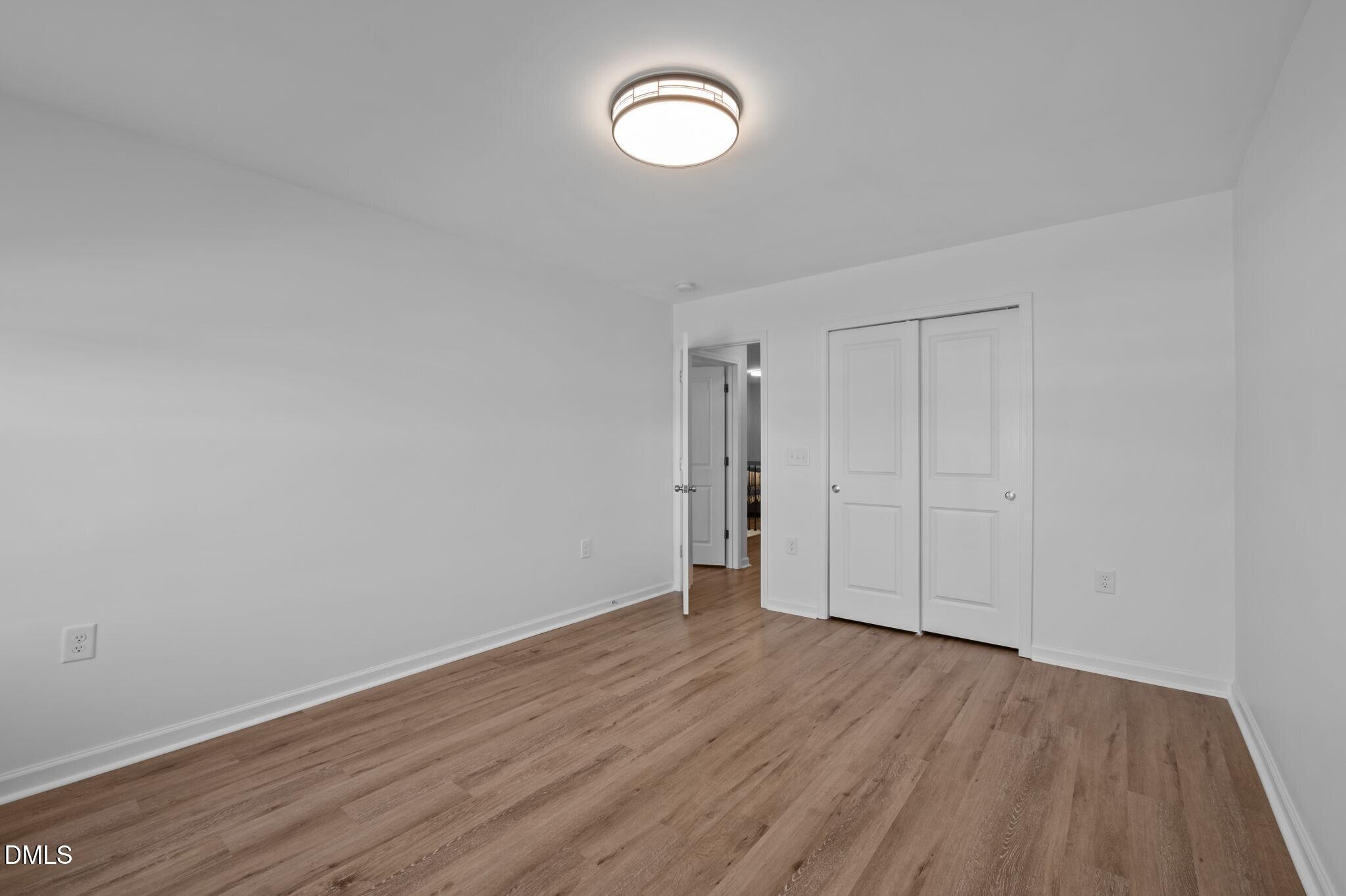 17 Rambler Lane Morrisville, NC 27560 - Photo 28 of 50 a view of room with wooden floor