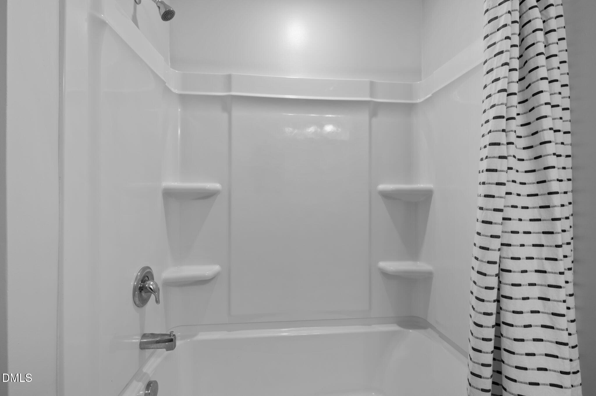 17 Rambler Lane Morrisville, NC 27560 - Photo 30 of 50 a bathroom with a shower a toilet and sink