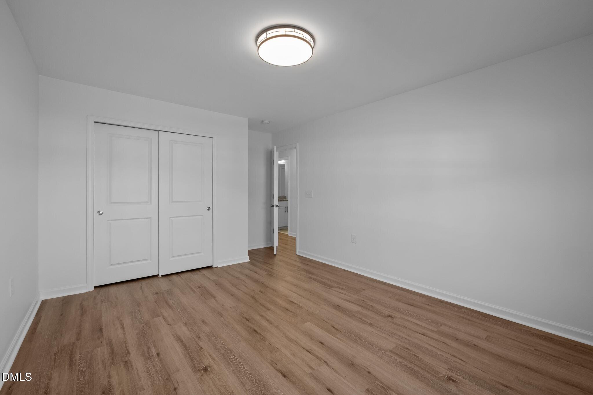 17 Rambler Lane Morrisville, NC 27560 - Photo 32 of 50 a view of room with wooden floor