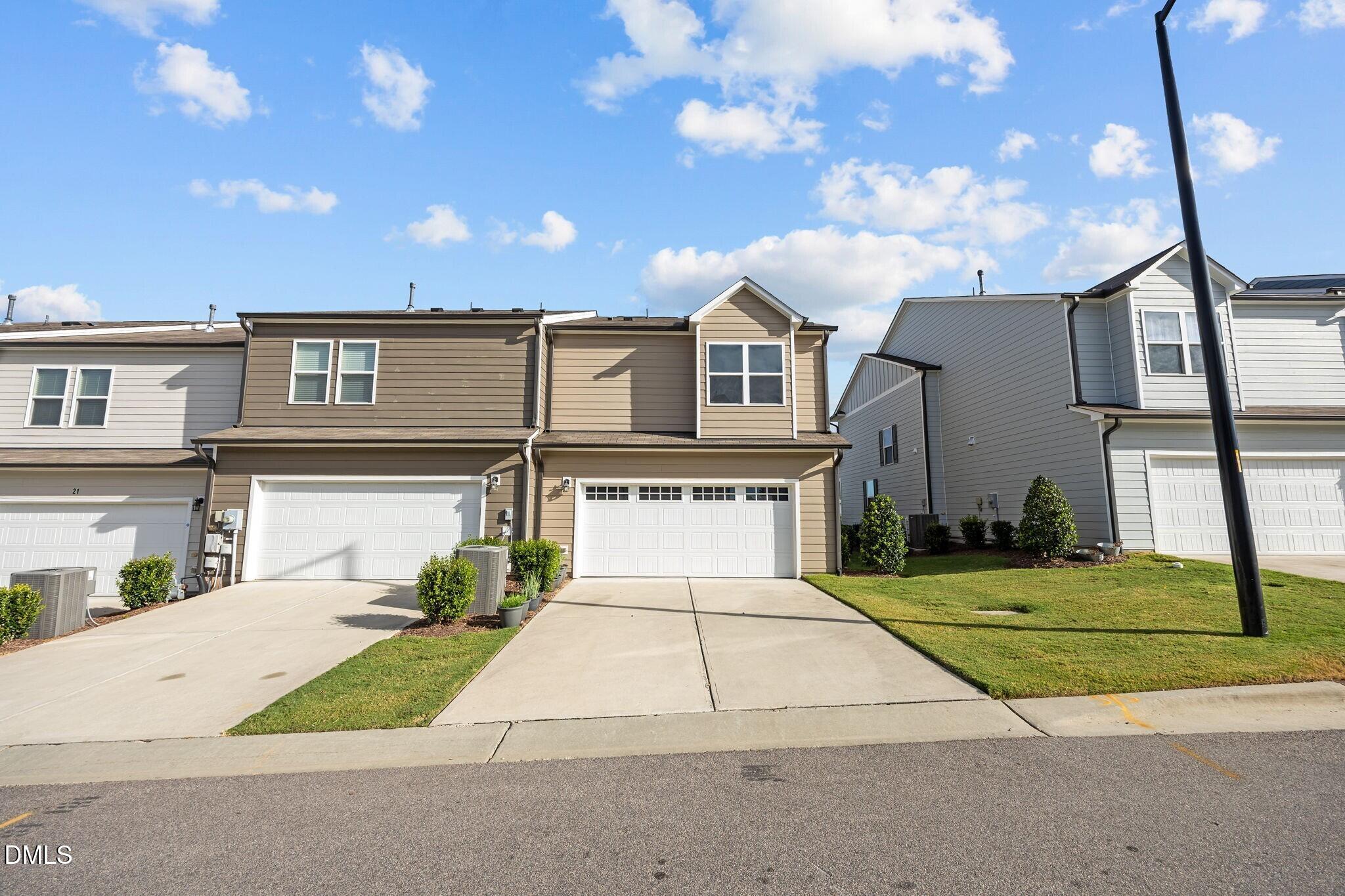 17 Rambler Lane Morrisville, NC 27560 - Photo 34 of 50 a front view of a house with a yard and garage