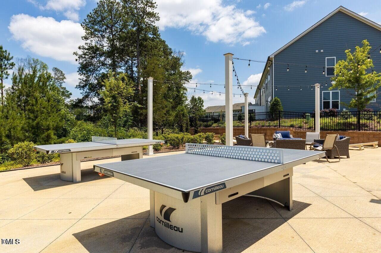 17 Rambler Lane Morrisville, NC 27560 - Photo 44 of 50 a view of a patio with a table and chairs