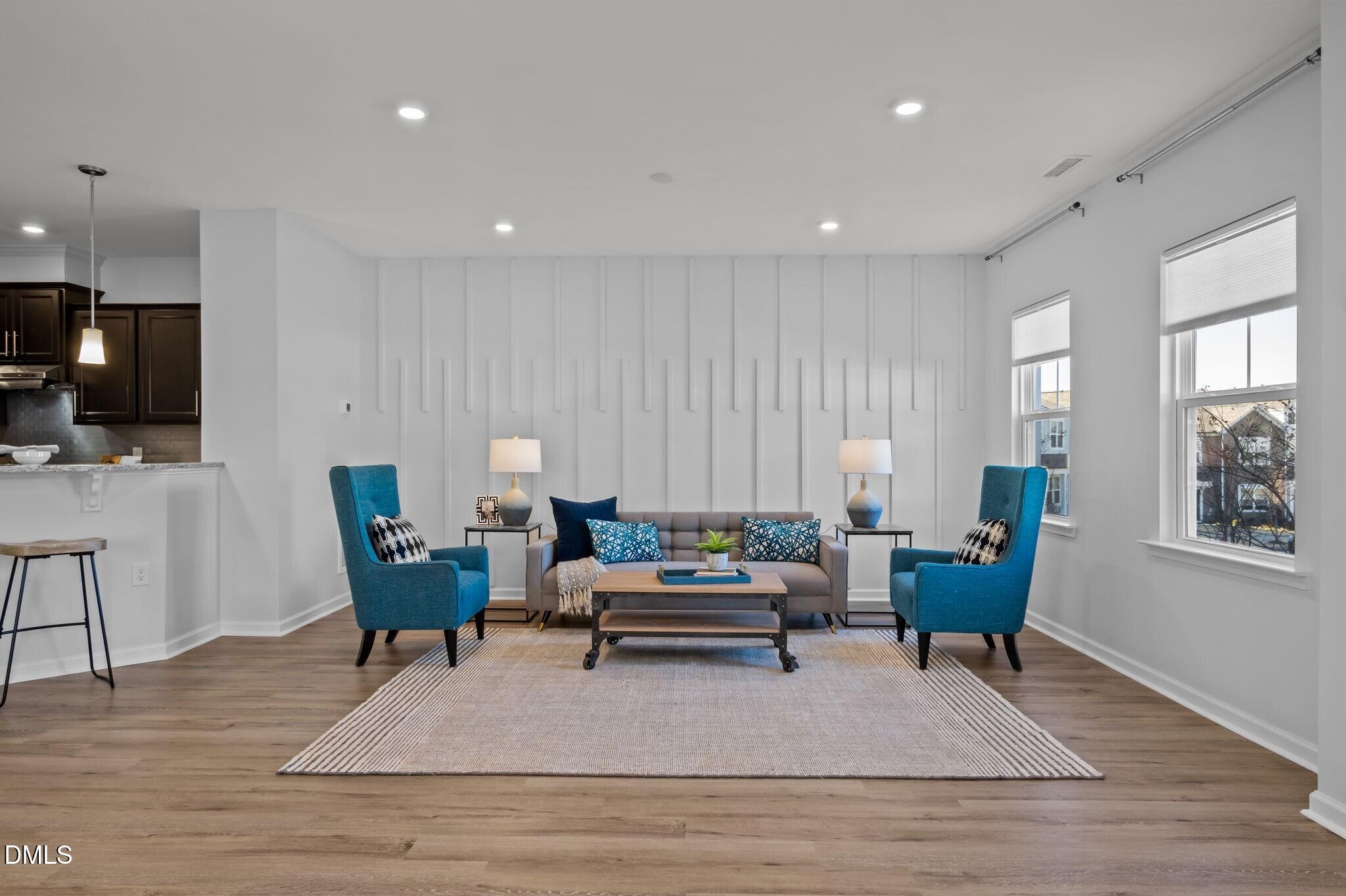 17 Rambler Lane Morrisville, NC 27560 - Photo 7 of 50 a living room with furniture a rug and a flat screen tv