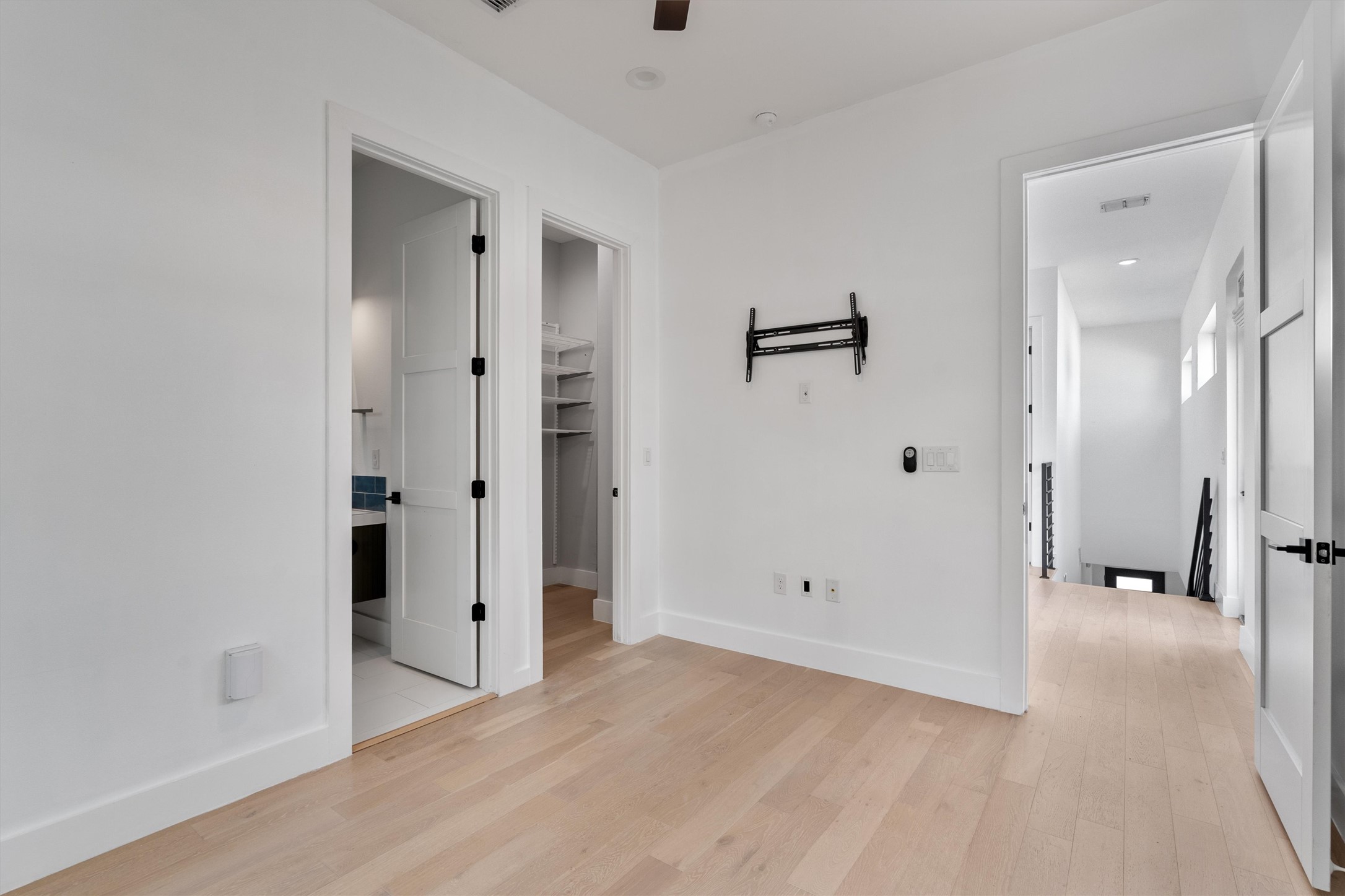 4712 Reyes Street, Unit 1 Austin, TX 78721 - Photo 17 of 38 a view of a bathroom with a tub shower and closet area