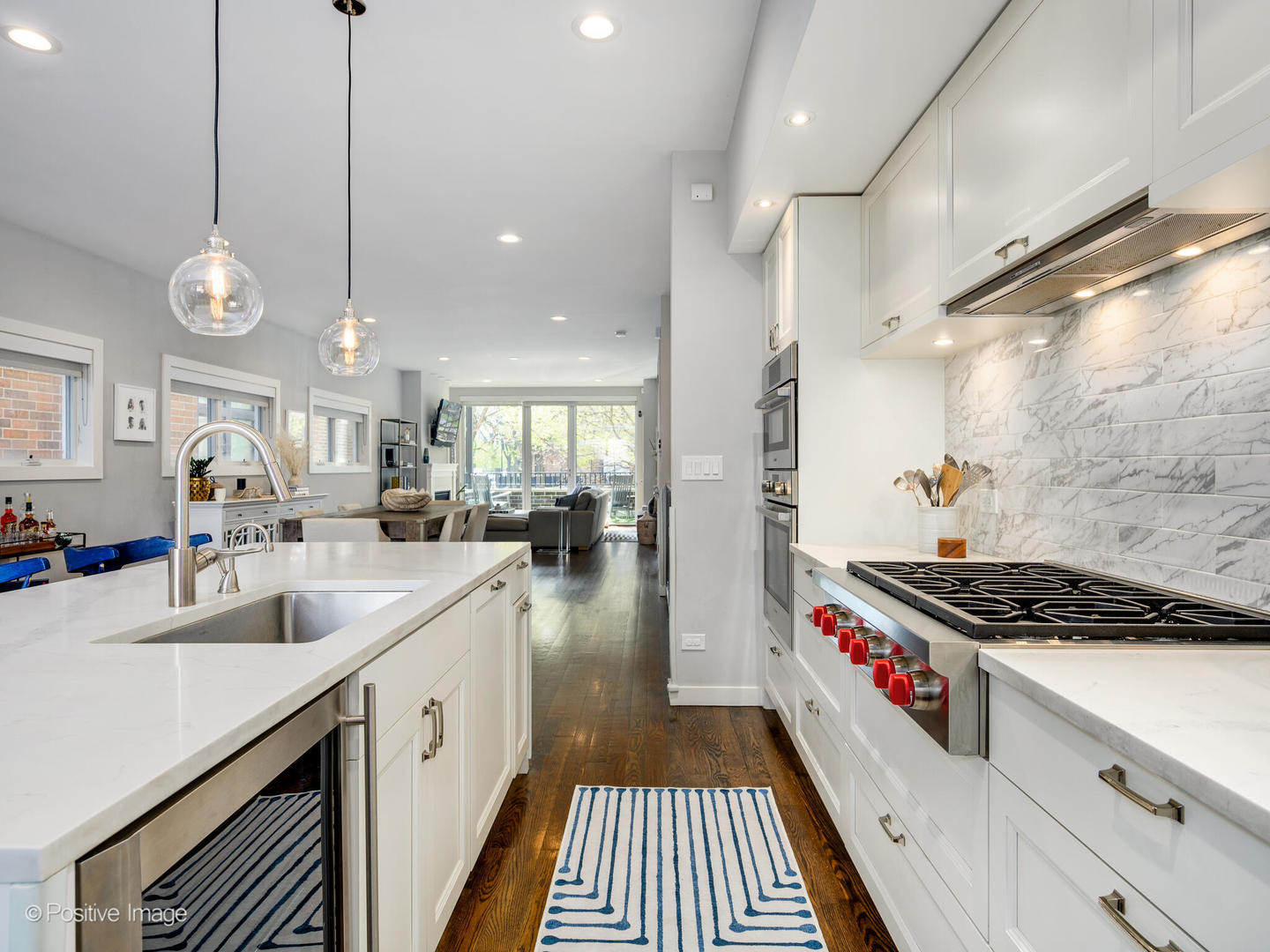 2235 North Oakley Avenue, Unit 1 Chicago, IL 60647 - Photo 12 of 27 a kitchen with sink stove and cabinets