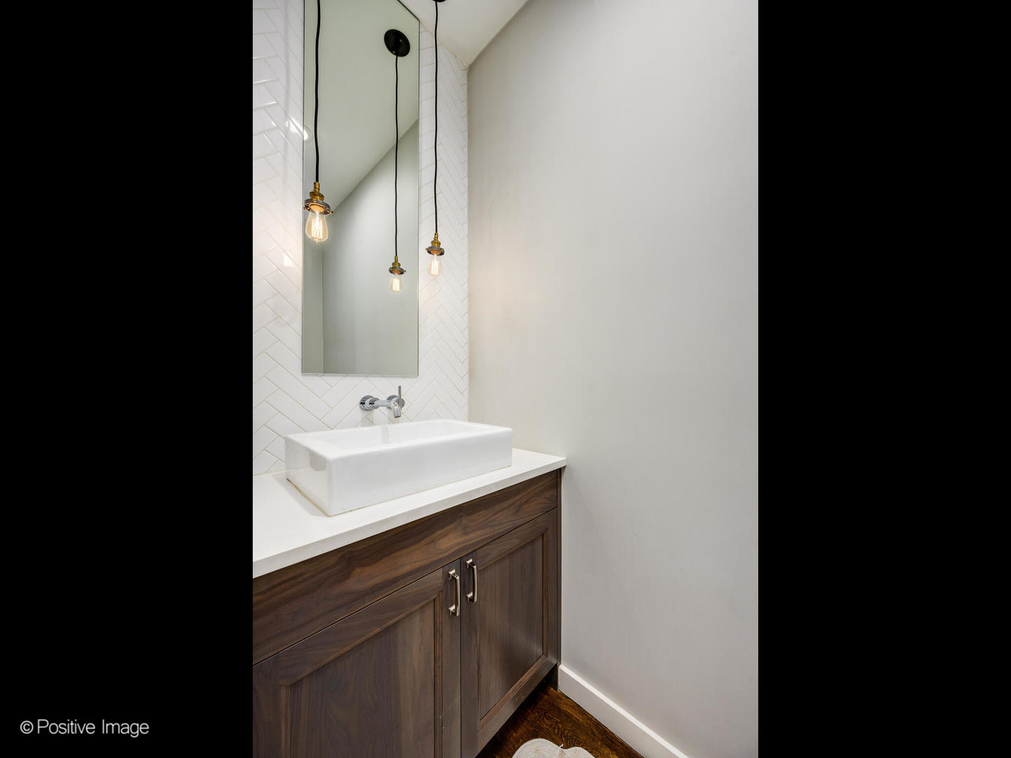 2235 North Oakley Avenue, Unit 1 Chicago, IL 60647 - Photo 14 of 27 a bathroom with a sink and a mirror