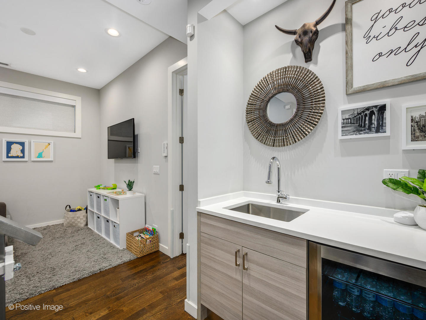 2235 North Oakley Avenue, Unit 1 Chicago, IL 60647 - Photo 15 of 27 a kitchen with a sink stainless steel appliances and a chandelier