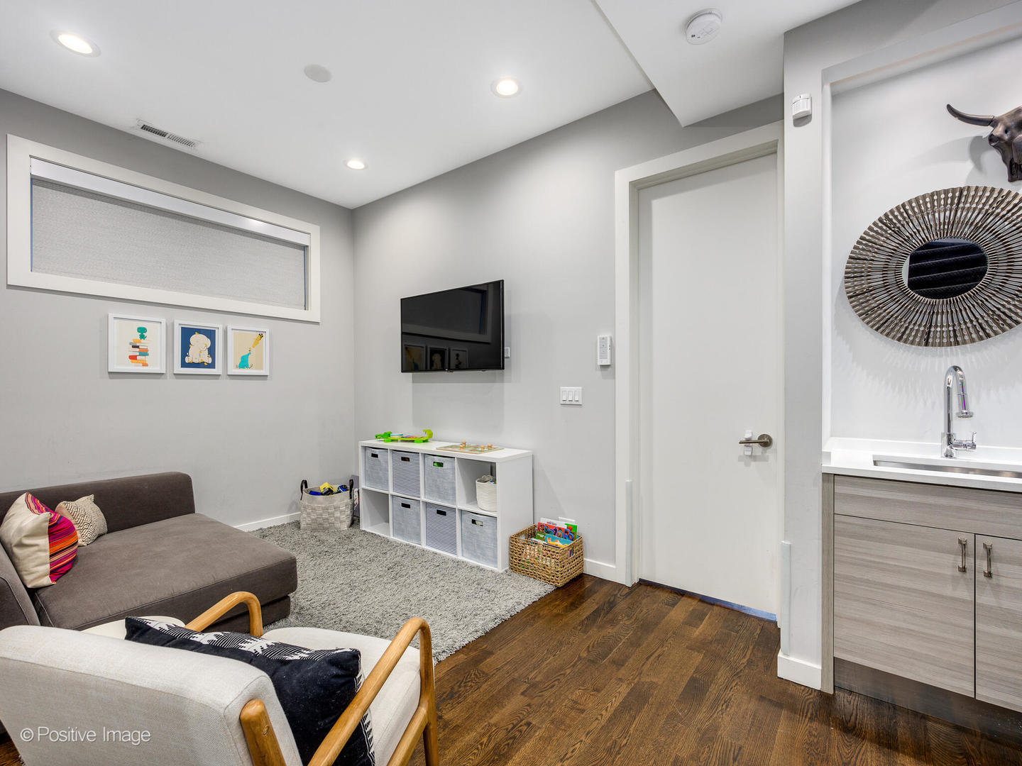 2235 North Oakley Avenue, Unit 1 Chicago, IL 60647 - Photo 16 of 27 a living room with furniture and a flat screen tv
