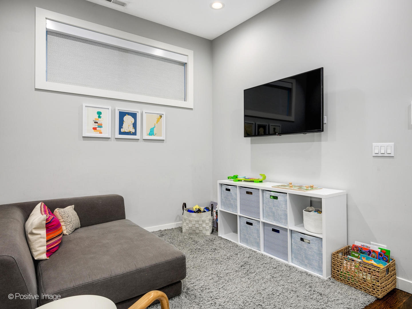 2235 North Oakley Avenue, Unit 1 Chicago, IL 60647 - Photo 17 of 27 a living room with furniture and a flat screen tv