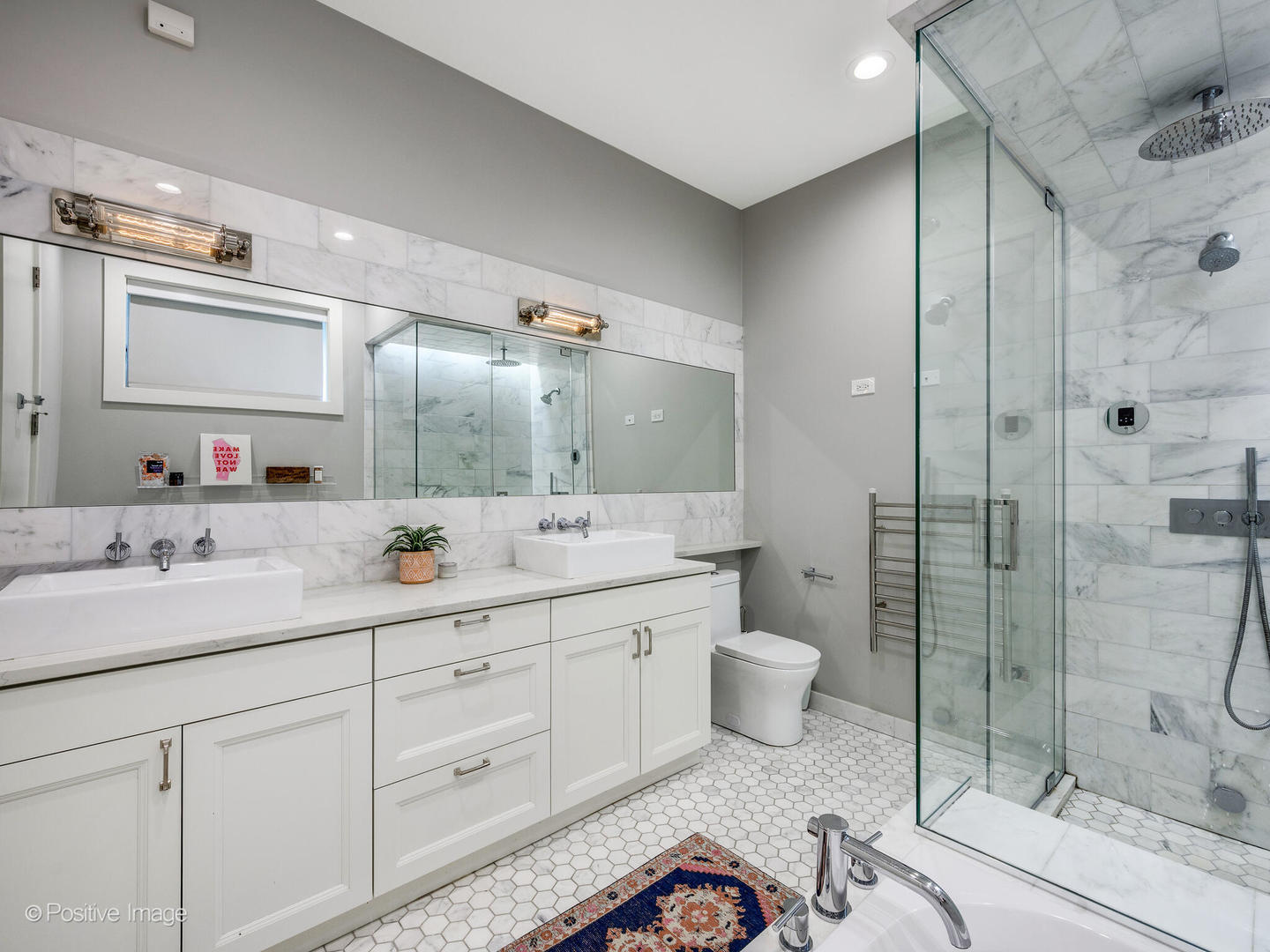 2235 North Oakley Avenue, Unit 1 Chicago, IL 60647 - Photo 19 of 27 a spacious bathroom with a granite countertop sink mirror and toilet
