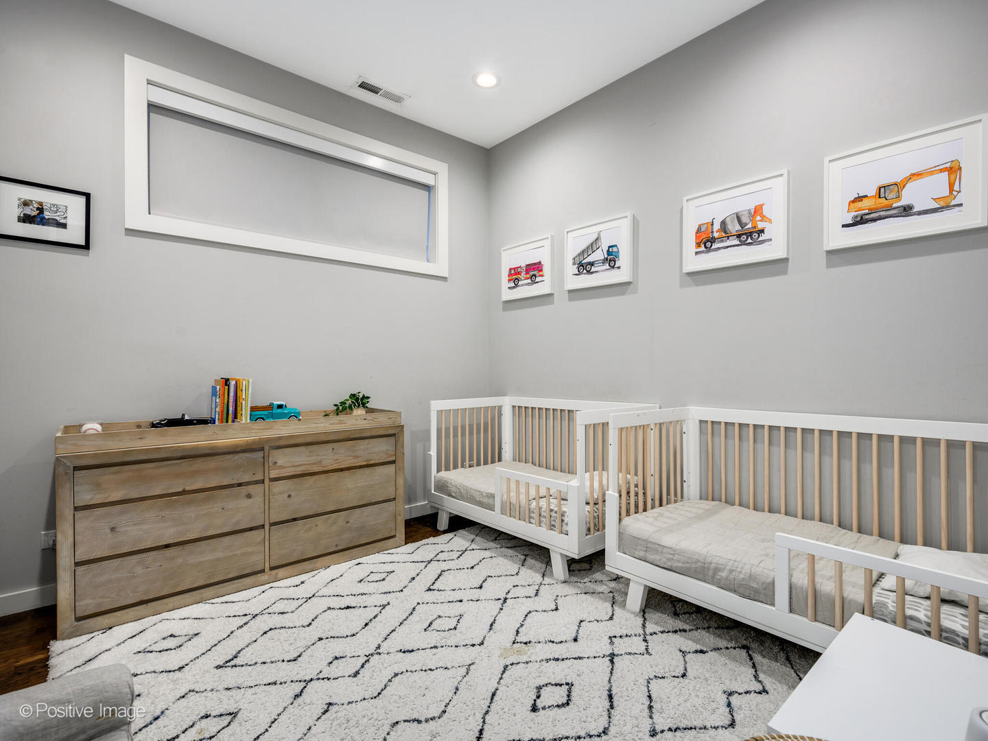 2235 North Oakley Avenue, Unit 1 Chicago, IL 60647 - Photo 21 of 27 a room with furniture and baby crib