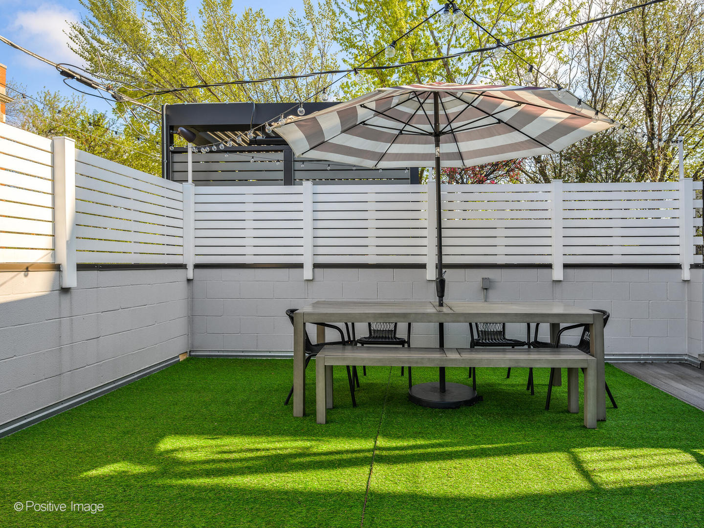 2235 North Oakley Avenue, Unit 1 Chicago, IL 60647 - Photo 25 of 27 a view of a chair and table in the backyard