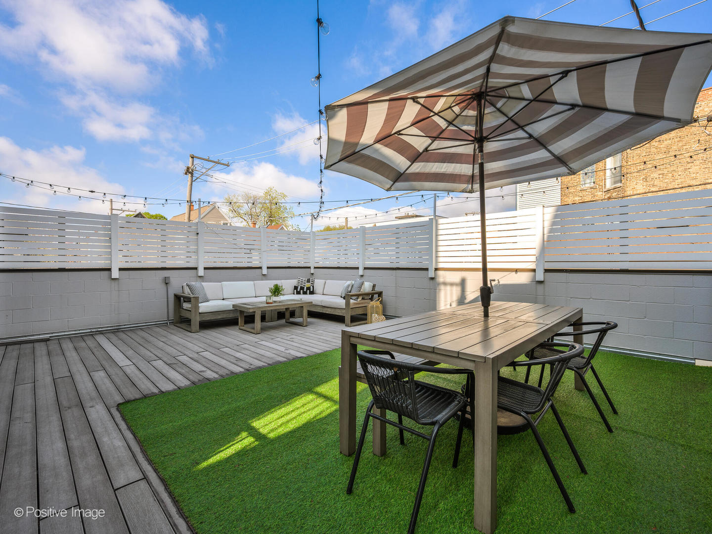 2235 North Oakley Avenue, Unit 1 Chicago, IL 60647 - Photo 26 of 27 a backyard of a house with table and chairs