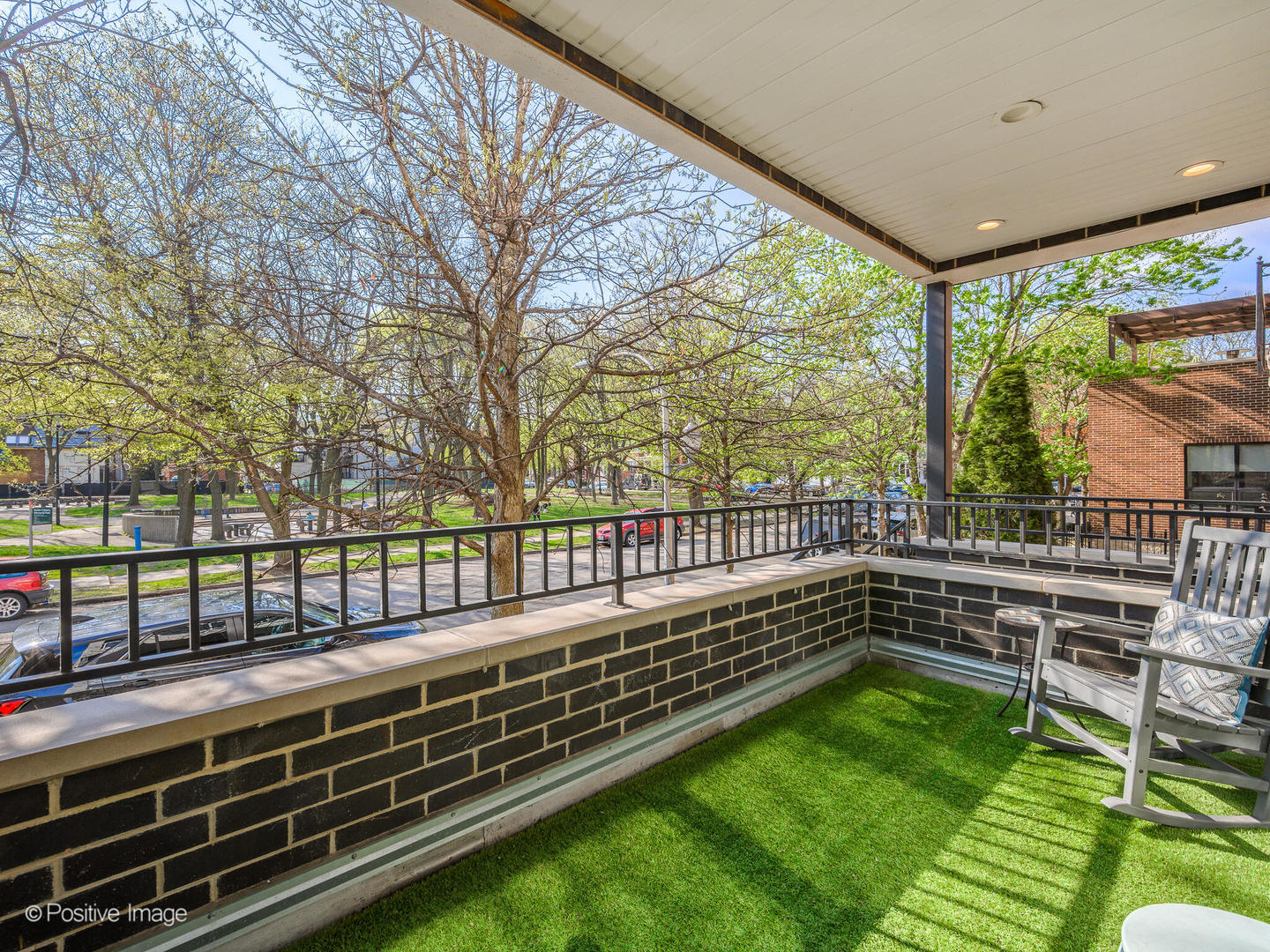 2235 North Oakley Avenue, Unit 1 Chicago, IL 60647 - Photo 27 of 27 a view of a porch with wooden floor and outdoor seating