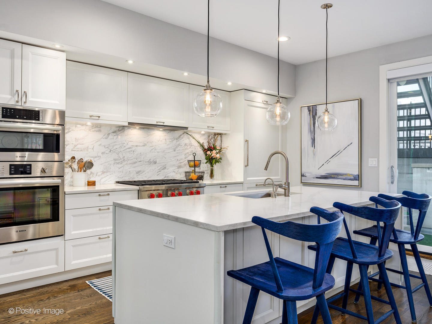 2235 North Oakley Avenue, Unit 1 Chicago, IL 60647 - Photo 10 of 27 a kitchen with stainless steel appliances granite countertop a stove a sink and a refrigerator