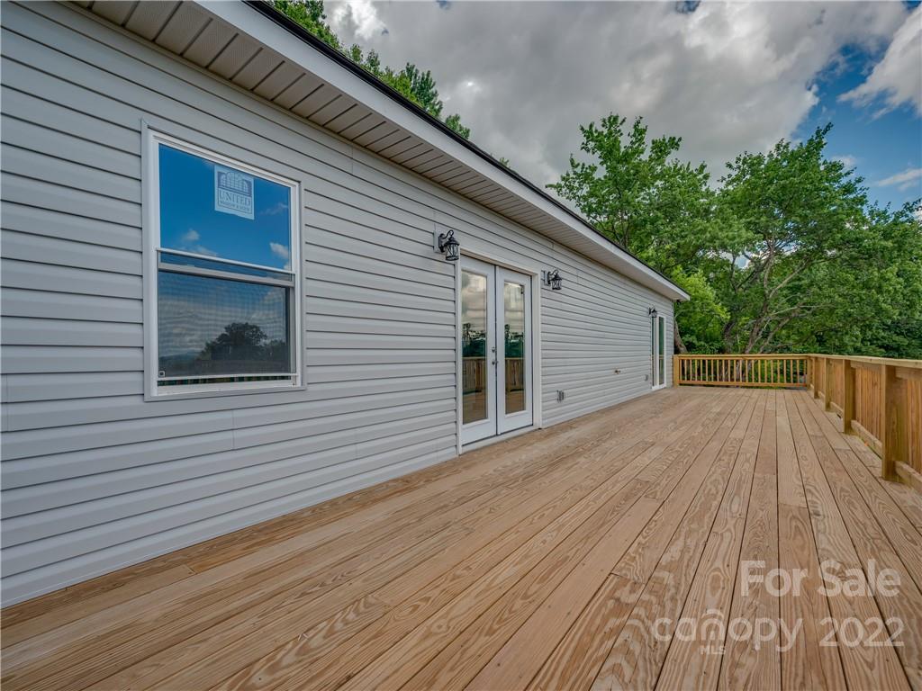 39 Hamilton Acrs Drive Tryon, NC 28782 - Photo 12 of 25 a view of a house with a roof deck