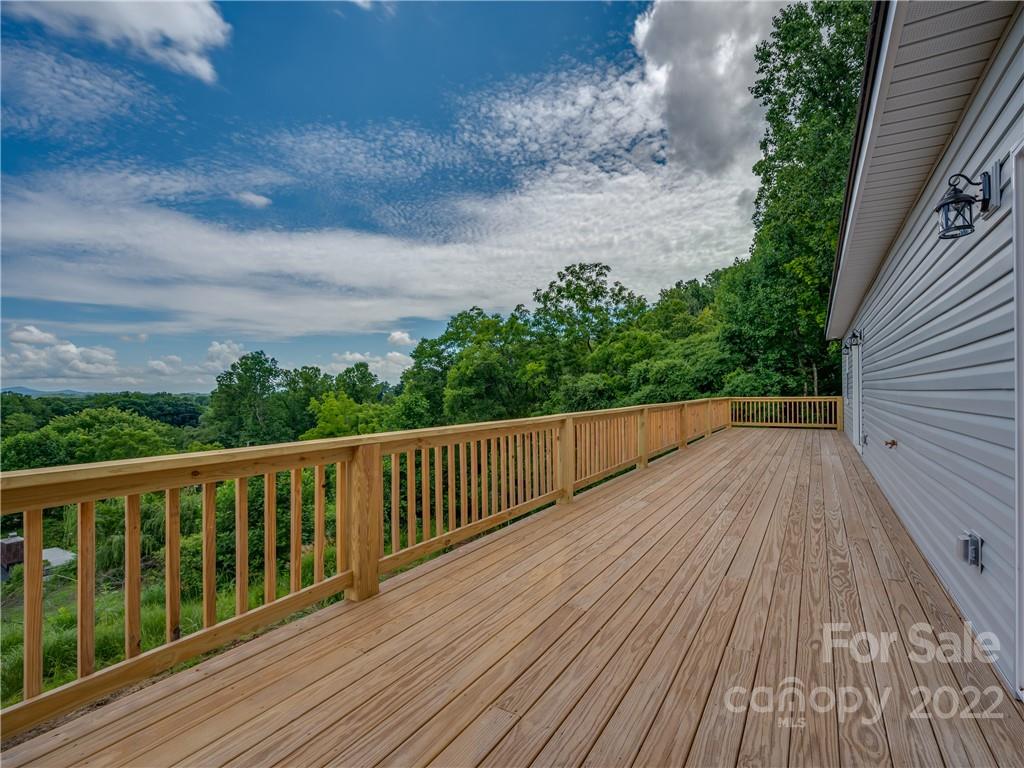 39 Hamilton Acrs Drive Tryon, NC 28782 - Photo 13 of 25 a balcony with wooden floor and fence
