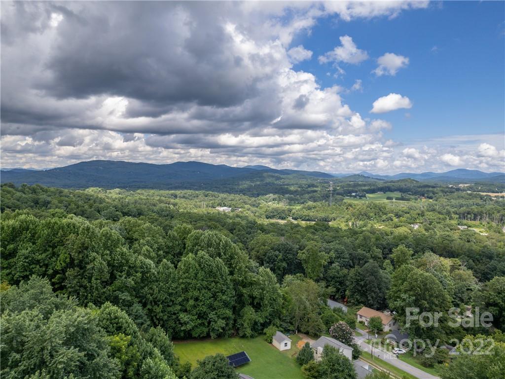 39 Hamilton Acrs Drive Tryon, NC 28782 - Photo 16 of 25 a view of a city with lush green forest