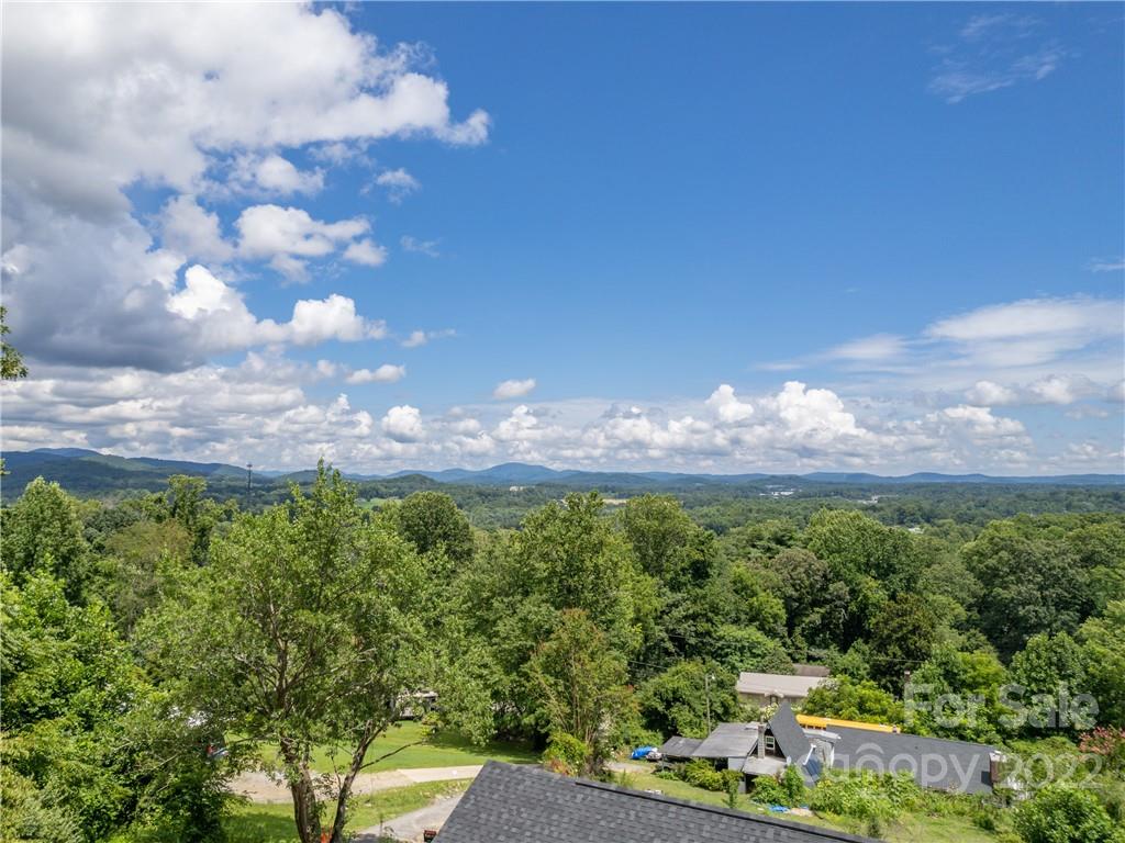 39 Hamilton Acrs Drive Tryon, NC 28782 - Photo 21 of 25 a view of a big yard with lots of green space and mountain view