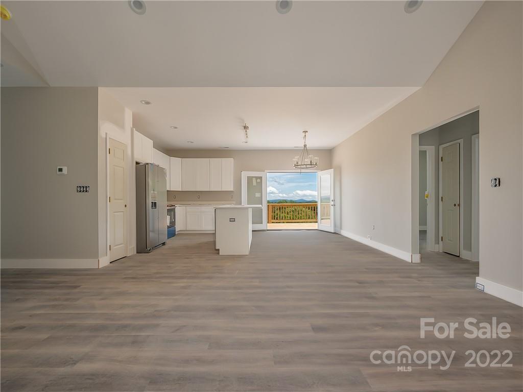 39 Hamilton Acrs Drive Tryon, NC 28782 - Photo 4 of 25 a view of empty room with a window and wooden floor