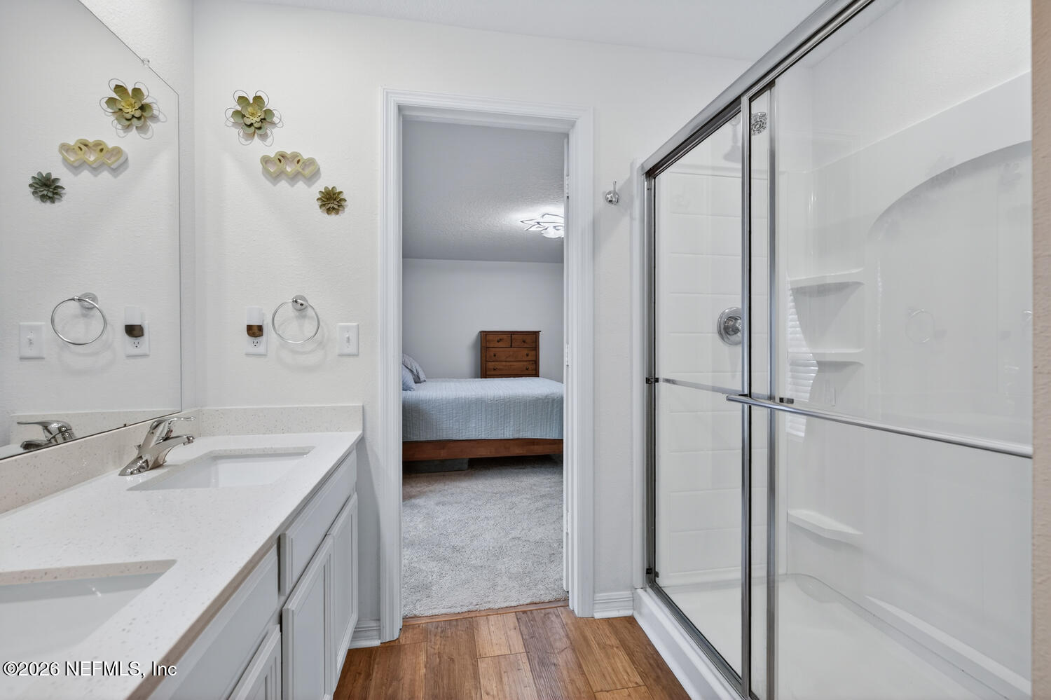 2 Radium Lane Palm Coast, FL 32164 - Photo 14 of 22 a en suite bathroom with a sink a mirror and a shower